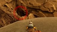 Climb on top of the root behind the red mushrooms and look for a cave at the base of the tree. (Image via Obsidian Entertainment)